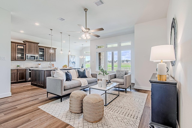 187 Peninsula Point Dr, Montgomery, TX 77356 - living room featuring light wood-type flooring, a ceiling fan, and baseboards