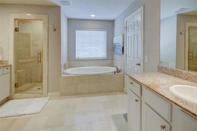 full bath featuring a bath, visible vents, a shower stall, and vanity