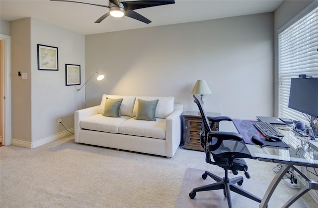 office area featuring baseboards, carpet, and a ceiling fan