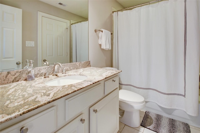 bathroom featuring vanity, tile patterned floors, toilet, and visible vents