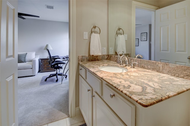 bathroom featuring tile patterned flooring, visible vents, vanity, and ceiling fan