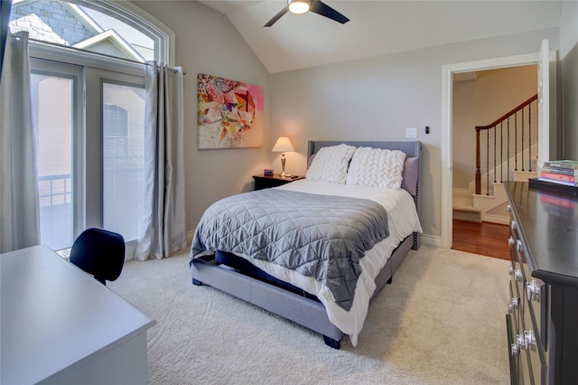 bedroom featuring carpet, a ceiling fan, and vaulted ceiling