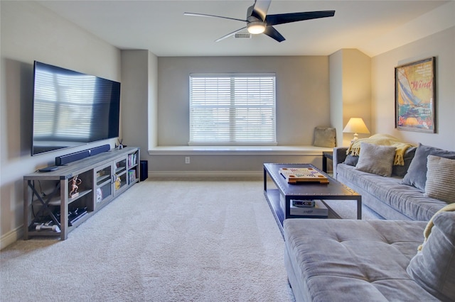 carpeted living room with visible vents, baseboards, and ceiling fan