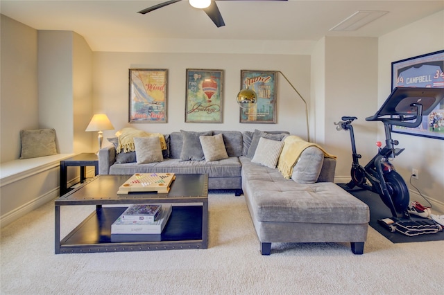 living room with baseboards, ceiling fan, and carpet flooring