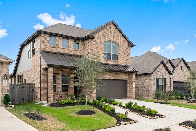 view of front of home featuring brick siding, concrete driveway, a standing seam roof, metal roof, and a front lawn