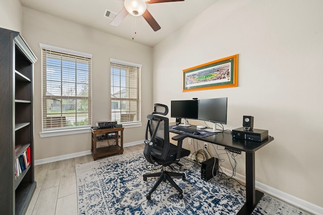 office with visible vents, ceiling fan, baseboards, and wood finished floors