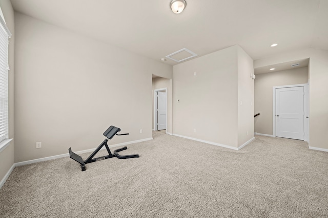 workout room featuring recessed lighting, baseboards, attic access, and light colored carpet