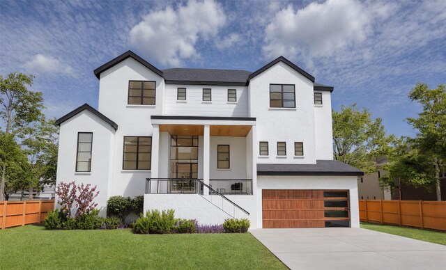 modern farmhouse featuring concrete driveway, stucco siding, an attached garage, fence, and a front yard