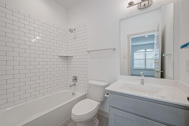 bathroom featuring tub / shower combination, vanity, and toilet