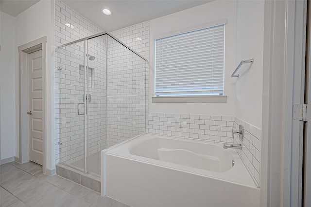 bathroom featuring tile patterned flooring, a shower stall, recessed lighting, and a bath