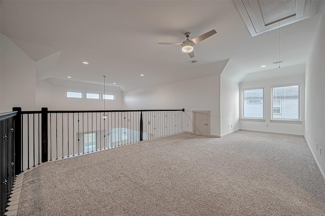 carpeted empty room with visible vents, recessed lighting, attic access, and a healthy amount of sunlight