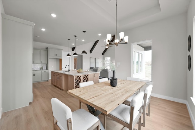 dining space featuring recessed lighting, baseboards, and light wood finished floors