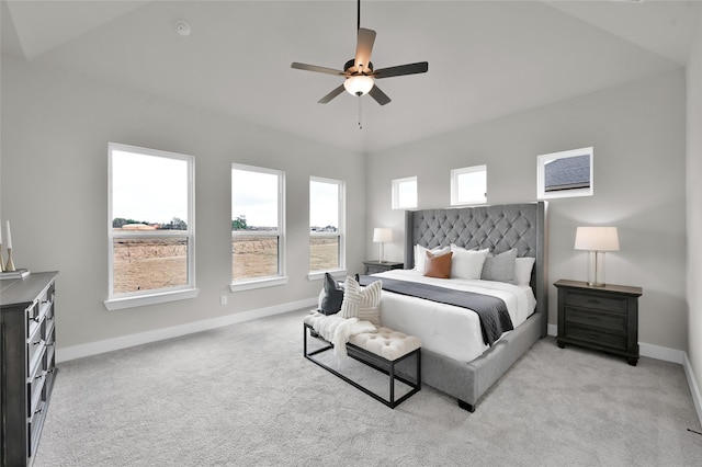 bedroom with light carpet, ceiling fan, and baseboards