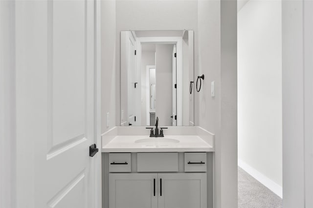 bathroom featuring vanity and baseboards