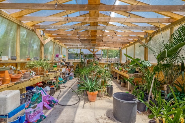 sunroom featuring vaulted ceiling