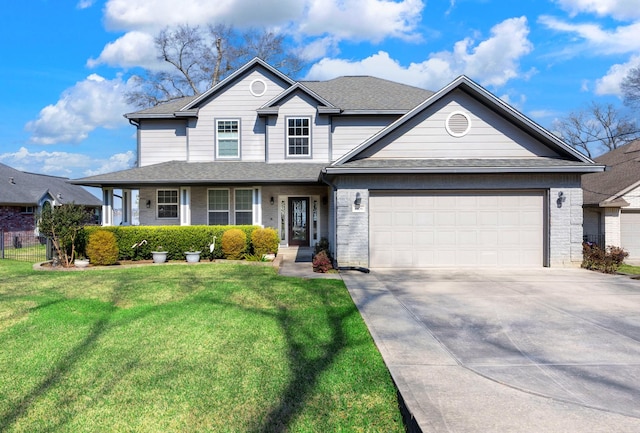 view of front of home with a garage, concrete driveway, roof with shingles, a front yard, and brick siding