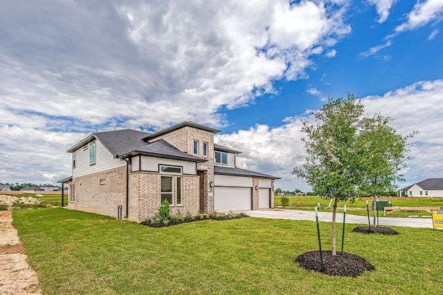141 Peninsula Point Dr, Montgomery, TX 77356 - view of front of house featuring brick siding, concrete driveway, an attached garage, and a front yard