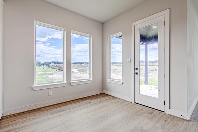 141 Peninsula Point Dr, Montgomery, TX 77356 - entryway featuring light wood finished floors, plenty of natural light, and baseboards