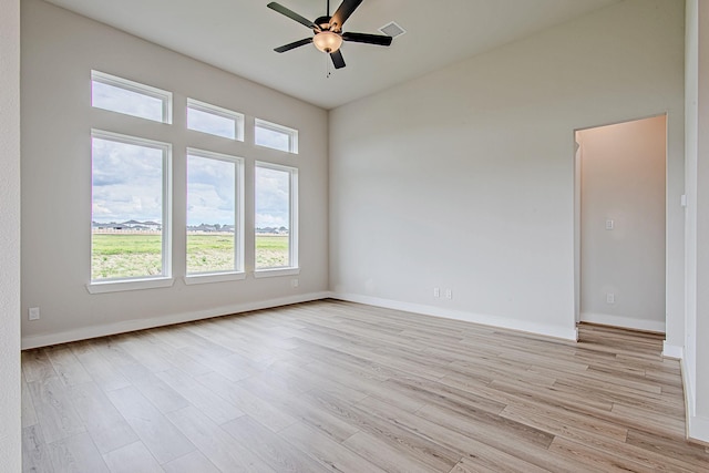 141 Peninsula Point Dr, Montgomery, TX 77356 - unfurnished room featuring ceiling fan, light wood-style flooring, and baseboards