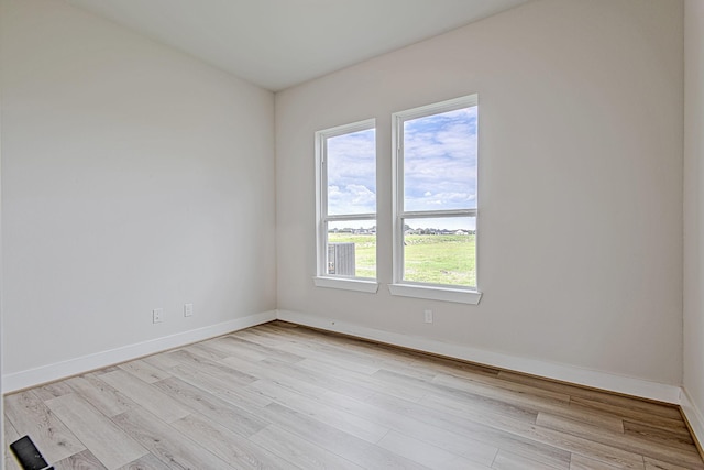 141 Peninsula Point Dr, Montgomery, TX 77356 - spare room featuring light wood-style floors and baseboards