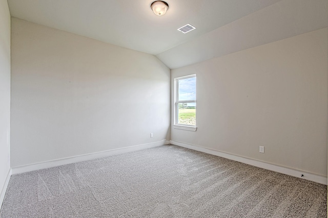 141 Peninsula Point Dr, Montgomery, TX 77356 - empty room with carpet floors, baseboards, and lofted ceiling