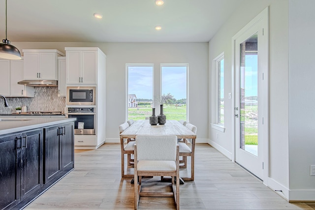 141 Peninsula Point Dr, Montgomery, TX 77356 - dining area with light wood-type flooring and recessed lighting