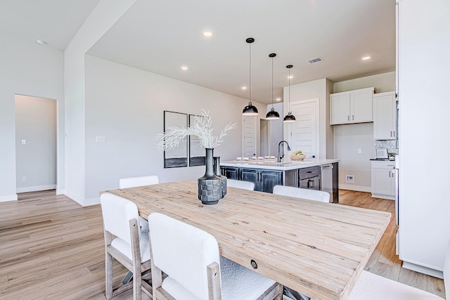 141 Peninsula Point Dr, Montgomery, TX 77356 - dining space with light wood-style flooring and recessed lighting