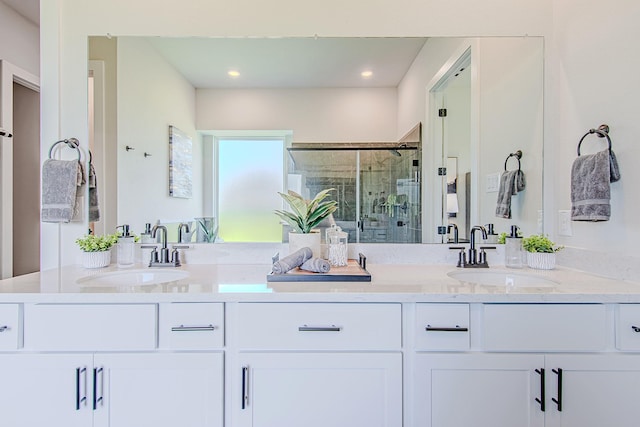141 Peninsula Point Dr, Montgomery, TX 77356 - bathroom featuring double vanity, a shower stall, and recessed lighting