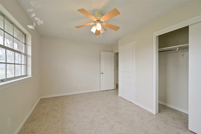 unfurnished bedroom with a ceiling fan, a closet, baseboards, and light tile patterned floors