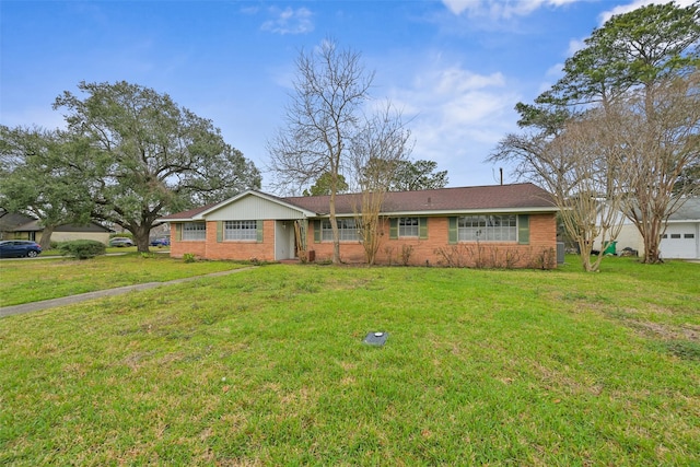 single story home featuring brick siding and a front lawn