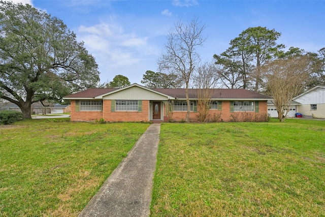 ranch-style house with brick siding and a front yard