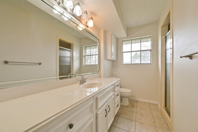 bathroom featuring toilet, tile patterned flooring, vanity, and a shower stall