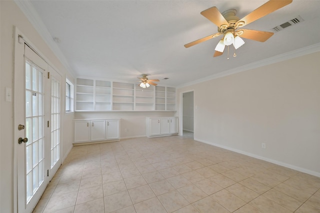 empty room featuring ornamental molding, visible vents, baseboards, and light tile patterned flooring