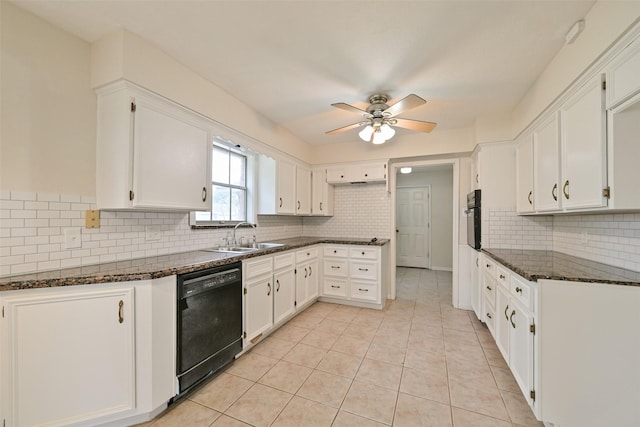 kitchen with dark stone countertops, a sink, black appliances, and light tile patterned floors