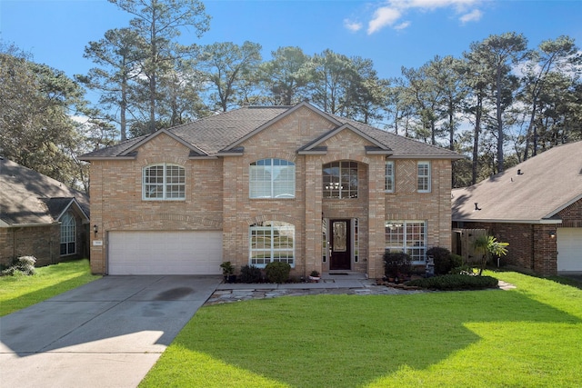 view of front of property featuring an attached garage, brick siding, a shingled roof, driveway, and a front yard