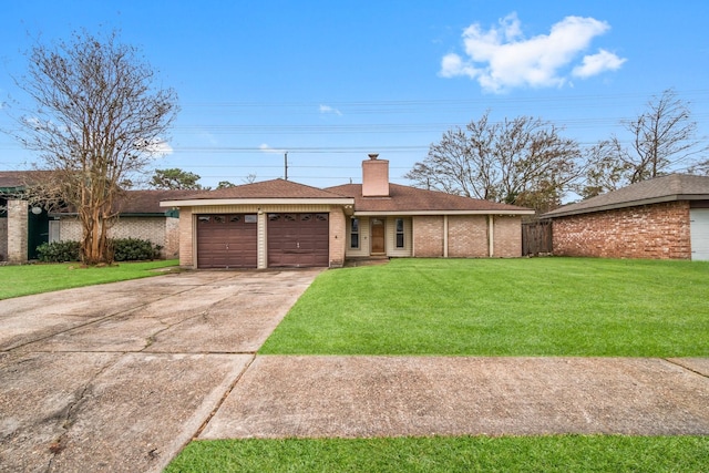 single story home with a front yard, brick siding, driveway, and an attached garage