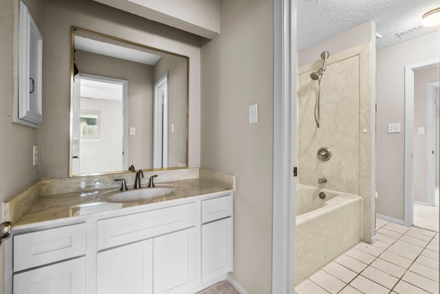 full bathroom featuring shower / bathtub combination, a textured ceiling, tile patterned flooring, vanity, and baseboards