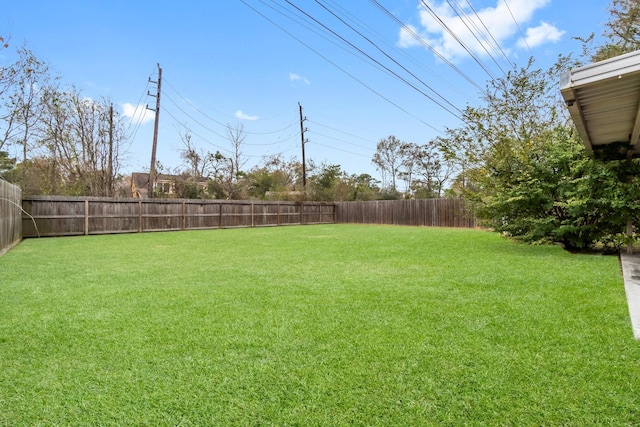 view of yard featuring a fenced backyard