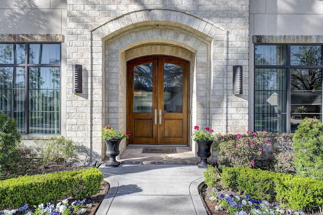 entrance to property featuring stone siding