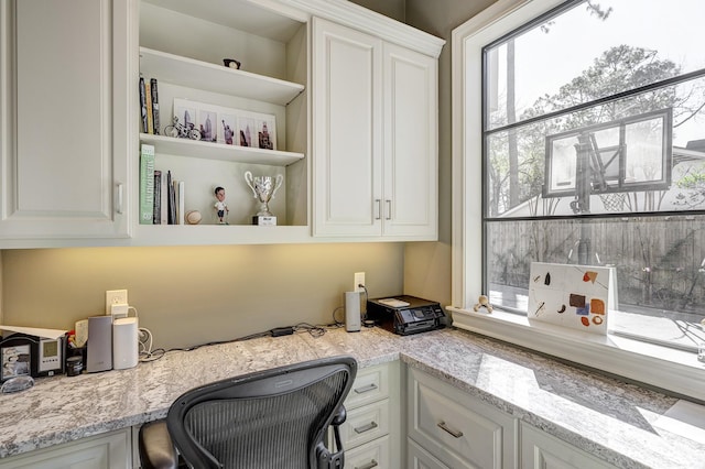 office area featuring built in desk