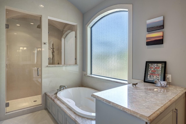 bathroom with vanity, a shower stall, and a bath