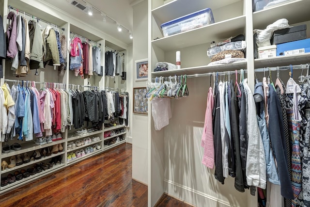 spacious closet with visible vents and wood finished floors