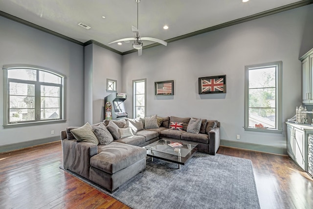 living room featuring ceiling fan, visible vents, baseboards, and dark wood finished floors