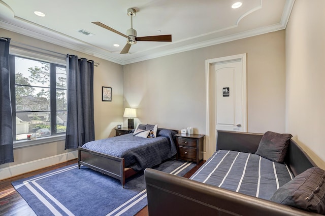 bedroom featuring visible vents, baseboards, ornamental molding, recessed lighting, and wood finished floors