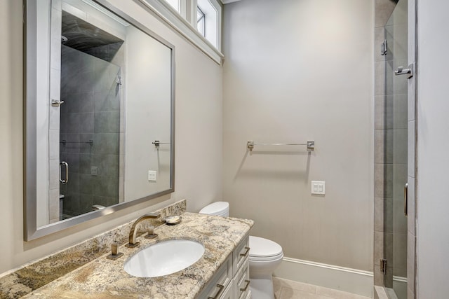 full bath with vanity, toilet, a stall shower, and tile patterned flooring