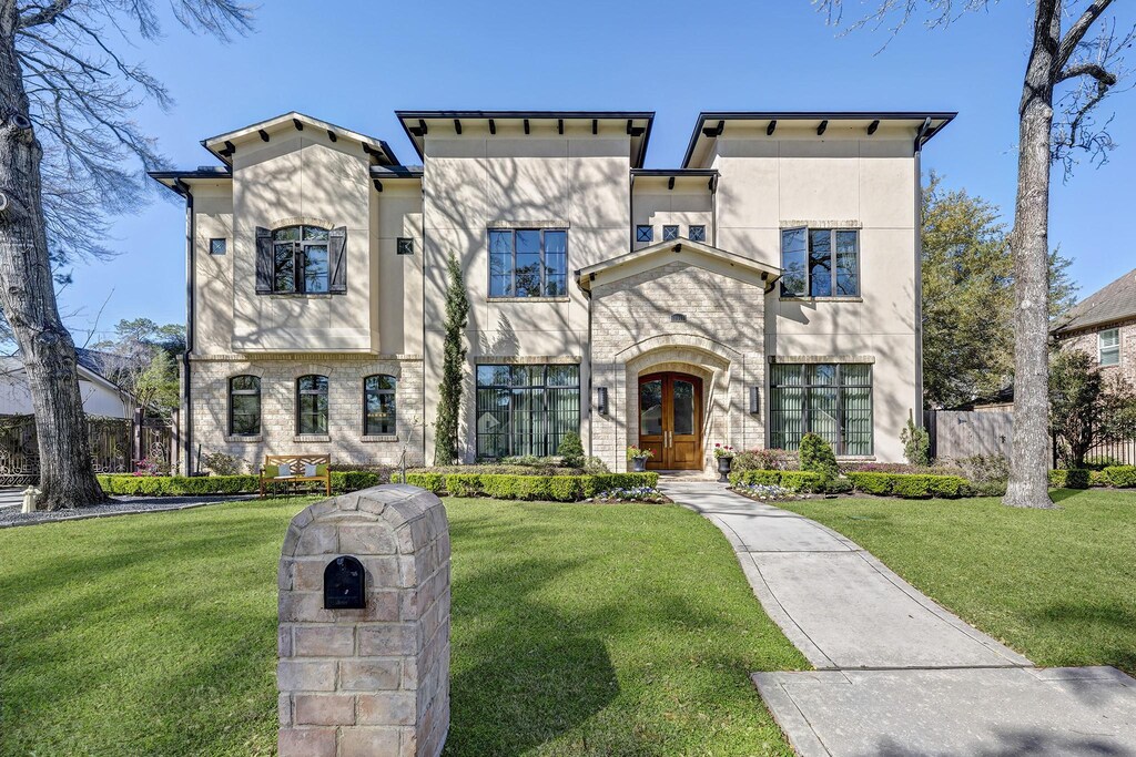 10918 Long Shadow Ln, Hunters Creek Village, TX 77024 - view of front of property with french doors, a front yard, fence, and stucco siding