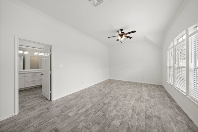 interior space featuring crown molding, light wood-style floors, visible vents, and ceiling fan