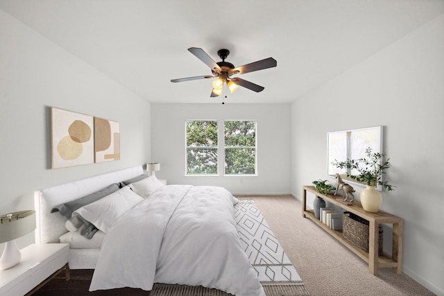 bedroom with baseboards, carpet, and ceiling fan