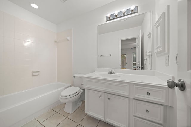 bathroom featuring tub / shower combination, toilet, vanity, and tile patterned flooring