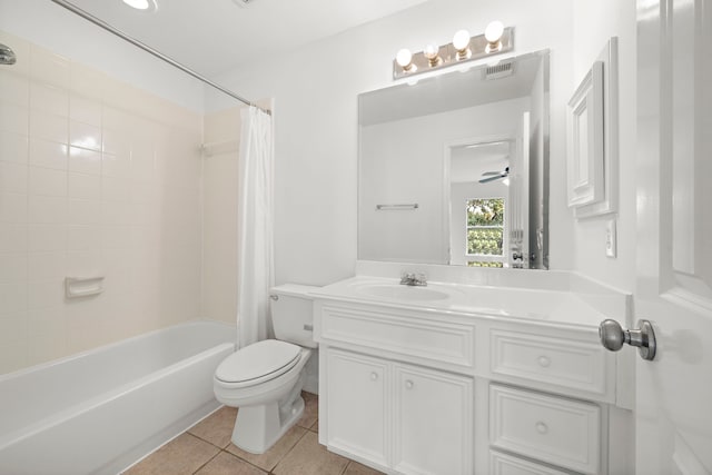 full bath with visible vents, toilet, shower / bath combo with shower curtain, tile patterned floors, and vanity